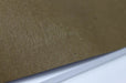 Close up of the embossed Clubcard branding on the back of a chicago screw notebook with kraft brown cover and white pages.
