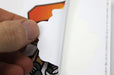 peeling a sticker form its backer - Clubcard printing