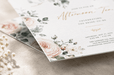 Detail view of custom 12pt recycled uncoated bridal shower invitation featuring gold foil stamped Afternoon Tea lettering and blush floral accents. printed by clubcard vancouver