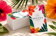 12pt recycled uncoated hang tags with gold foil stamped accents and tropical floral design for Solena Studio