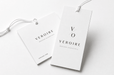 Extra thick minimalist 24pt recycled uncoated apparel hang tags printed by Clubcard Vancouver for Veroire Modern Essentials featuring white cord strings
