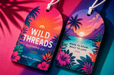 Extra thick 24pt recycled uncoated apparel hang tags for Wild Threads Clothing Co. with sunset beach artwork and string cords by Clubcard Vancouver