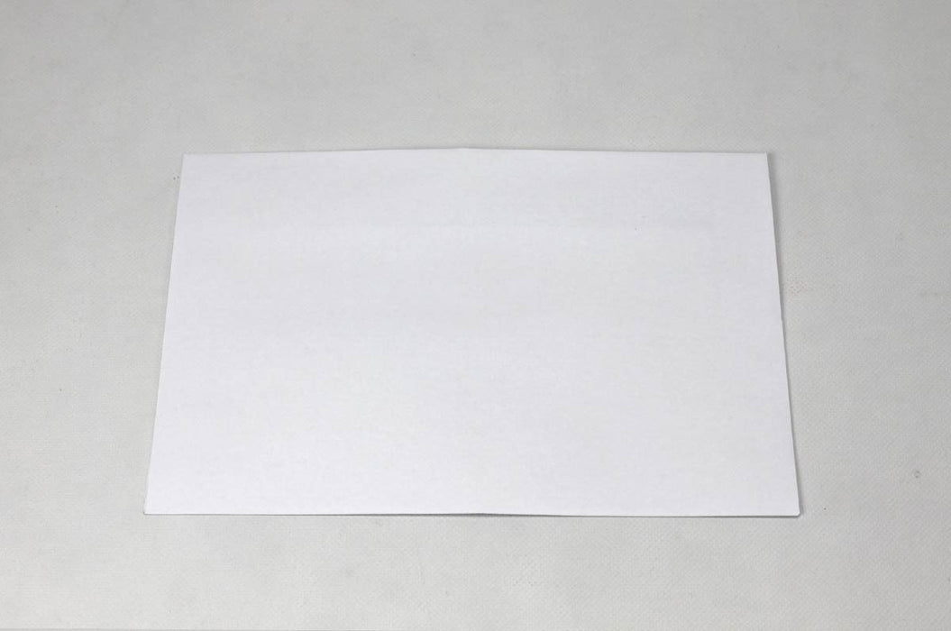 Single blank white wove envelope laying flat on a light textured background.