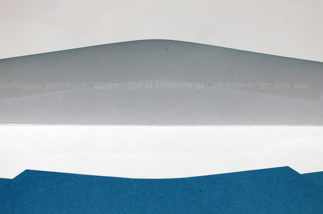 Close-up view showing the open back flap and white interior of a blue 70lb uncoated No. 10 envelope