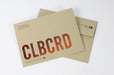 Custom printed Desert Storm kraft envelopes with bold red CLBCRD branding and return address on light sand textured paper.