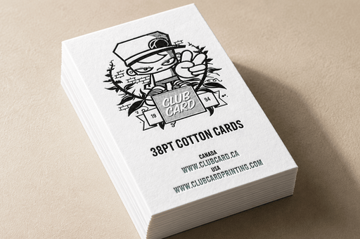 Stack of custom 38pt ultra-thick cotton business cards featuring Clubcard Vancouver's peace man mascot letterpress printed with iridescent foil and black ink set on a neutral background, printed by Clubcard Vancouver