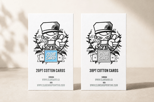 side-by-side comparison of 20pt and 38pt cotton letterpress business cards featuring Clubcard Vancouver's peace man mascot, with the 20pt card on the left featuring a blind debossed logo over a metallic blue foil square and the 38pt card on the right featuring a blind debossed logo over an iridescent foil square, printed by Clubcard Vancouver