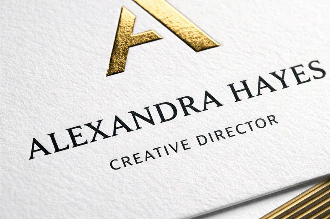 Close-up of a custom 38pt ultra-thick cotton letterpress business card featuring gold foil monogram and gilded edges for Alexandra Hayes, printed by Clubcard Vancouver