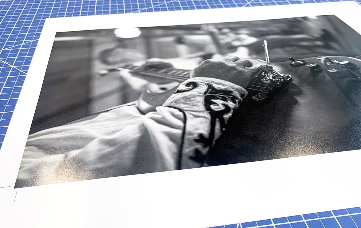 Black and white fine art photo print being trimmed on a cutting mat, produced by Clubcard Vancouver