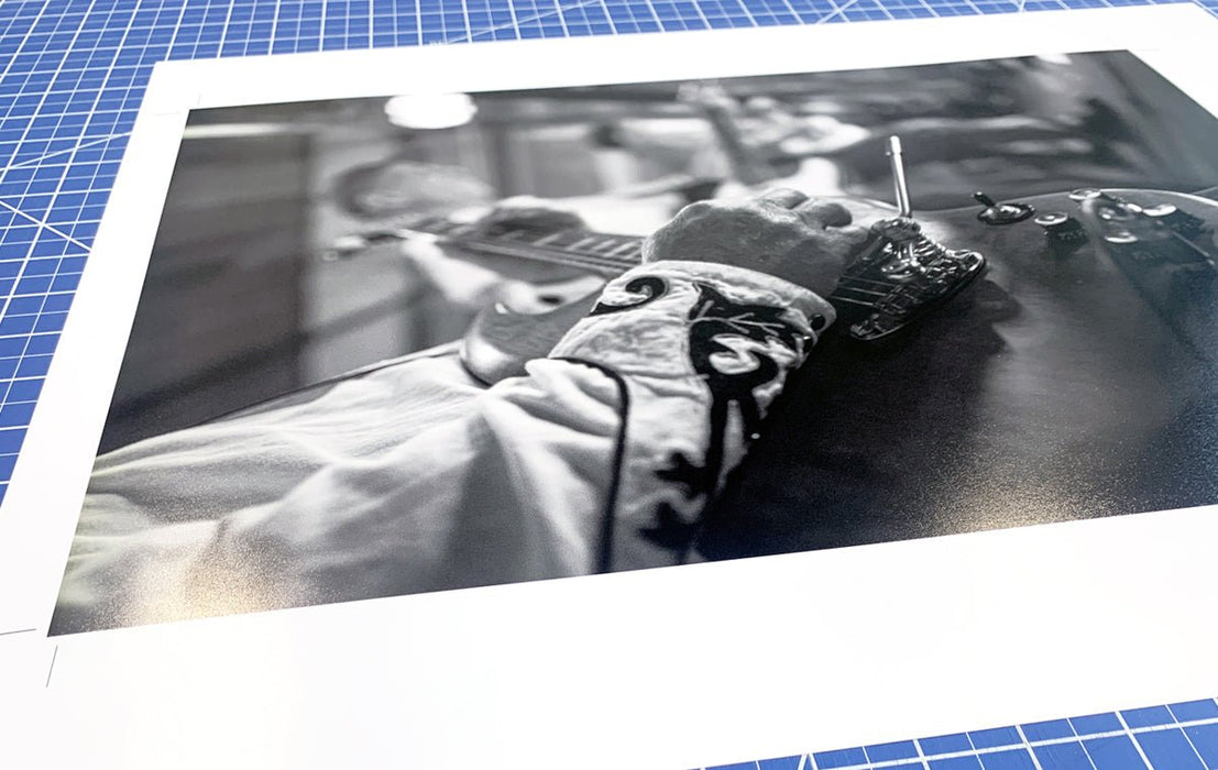 Black and white fine art photo print being trimmed on a cutting mat, produced by Clubcard Vancouver