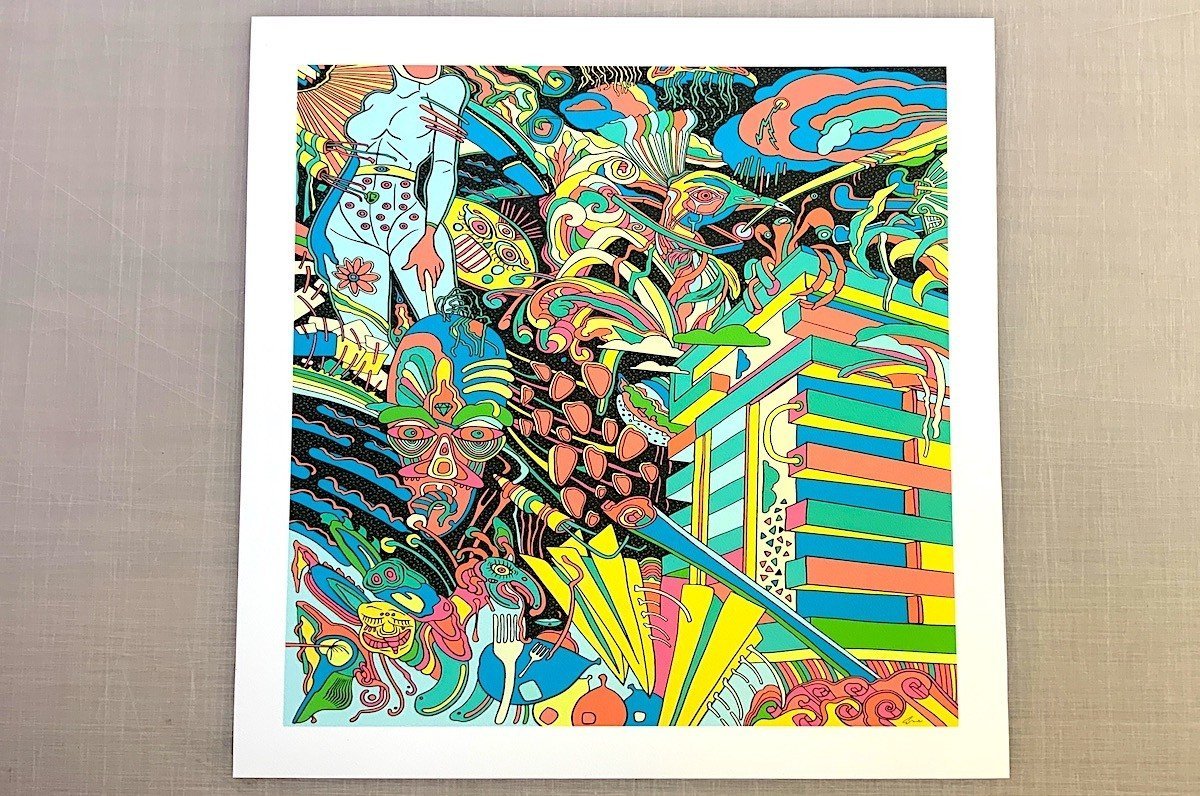 Fine art print sample featuring a vibrant, colourful surrealist artwork framed with a white mat border, printed by Clubcard Vancouver