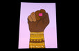 Fine art print sample featuring a raised fist illustration with ornate yellow pattern bands by artist Jag Nagra, printed by Clubcard Vancouver