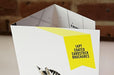 Close-up view of a coated card stock brochure with a yellow specs badge printed by Clubcard Printing Canada