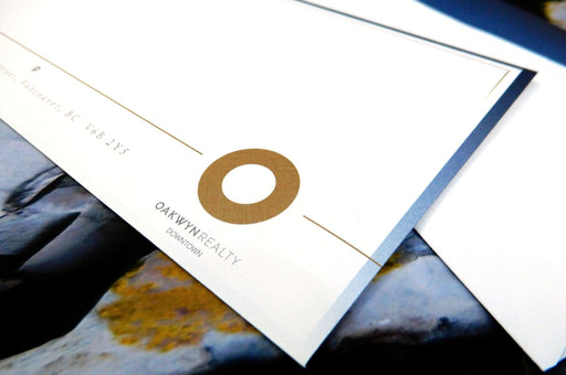 Custom printed Oakwyn Realty Downtown No. 10 linen envelope sample displayed close up