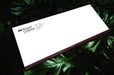 Custom printed Royal Claims Services Ltd. No. 10 uncoated envelope displayed on a green leafy background