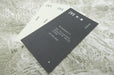 Fan display of black and white business cards printed on 16pt bamboo card stoc