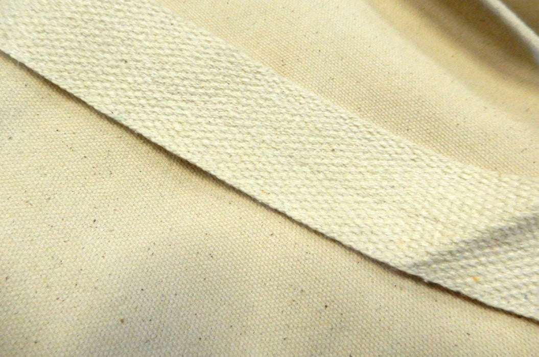 Close-up detail of a durable woven strap handle on a heavyweight natural cotton canvas tote bag - Clubcard Vancouver