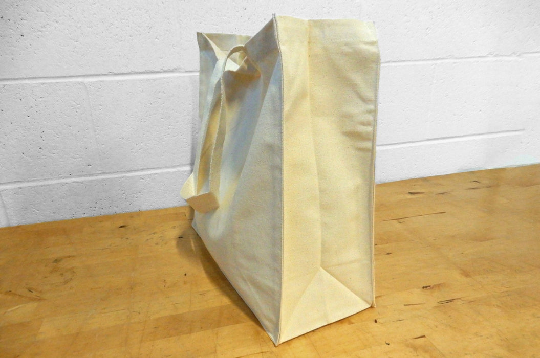 Heavyweight 12oz natural cotton canvas tote bag with side and bottom gusset standing on a wood surface - Clubcard Vancouver