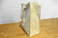 Heavyweight 12oz natural cotton canvas tote bag with side and bottom gusset standing on a wood surface - Clubcard Vancouver