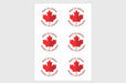 Sticker sheet with six large two inch white circular bilingual Made in Canada Fabrique au Canada maple leaf stickers