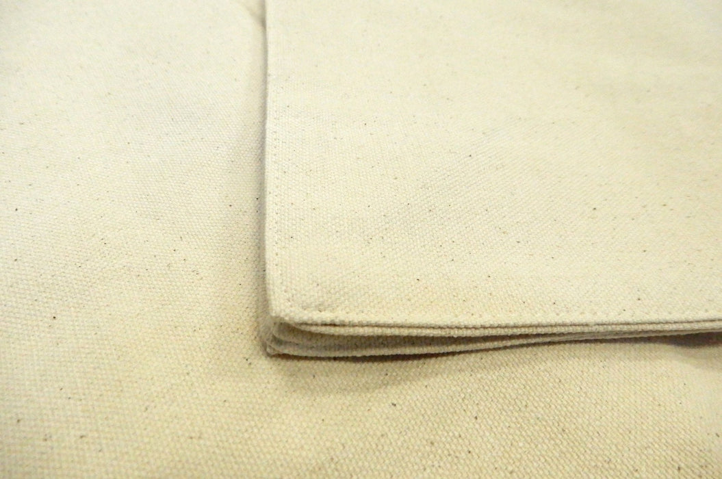 Close-up detail of natural unprinted cotton canvas tote bag fabric texture and stitched corners - Clubcard Vancouver