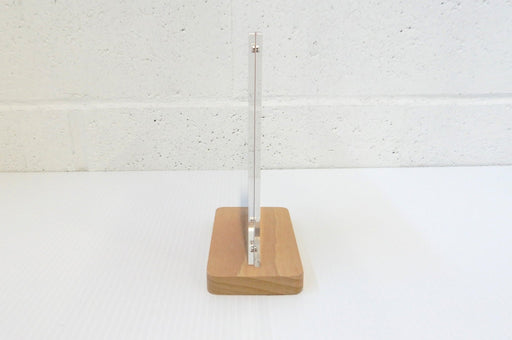 Side profile view of a quick-change acrylic 4x6 sign and menu holder standing in a wooden base