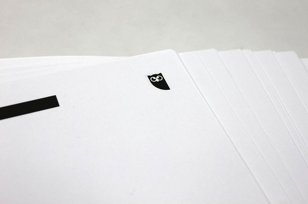 Stacked fan of 70lb uncoated white letterhead sheets featuring a black logo in the top corner