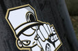Close-up detail shot of a custom cartoon character graphic printed on smooth anti-curl vinyl for a tabletop retractable banner stand.