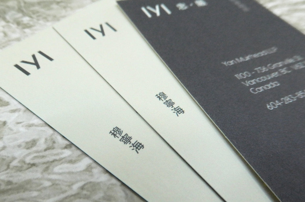 Close up of custom printed business cards on 16pt textured bamboo card stock