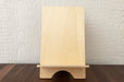 Birch Plywood book display stand on a wooden table.