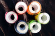 Top view of rolls of Standard Shape Non-Weatherproof Flexo Stickers | Clubcard Printing Vancouver