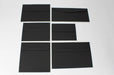 Six different sizes of uncoated blank eclipse black envelopes on a white background.